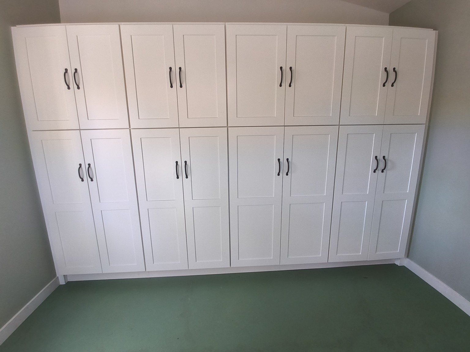 White custom built-in cabinetry installed by Shalom Construction